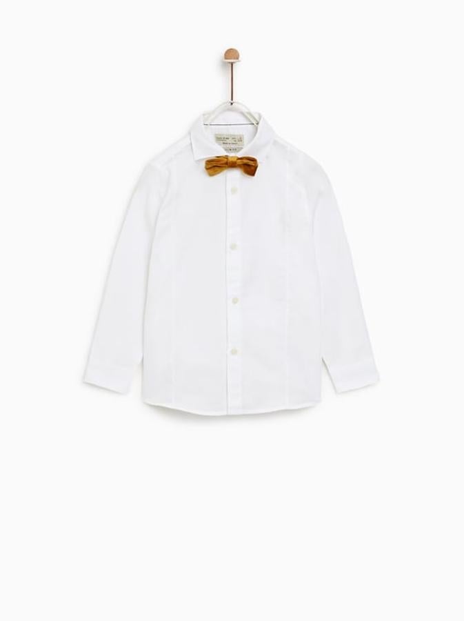 Camisa básica blanca con pajarita en color mostaza de terciopelo: 19,95€ en Zara Kids