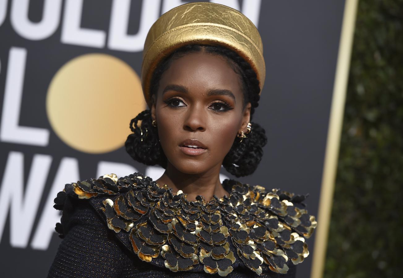 Este fue sin duda otro de los 'looks' más atrevidos de los premios. En este Janelle Monae se decantó por unas trenzas recogidas en dos moños bajos y por un maxi tocado dorado.