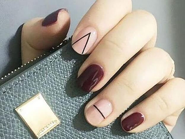 Fantástica manicura que altera un bloque de color con una geometría.