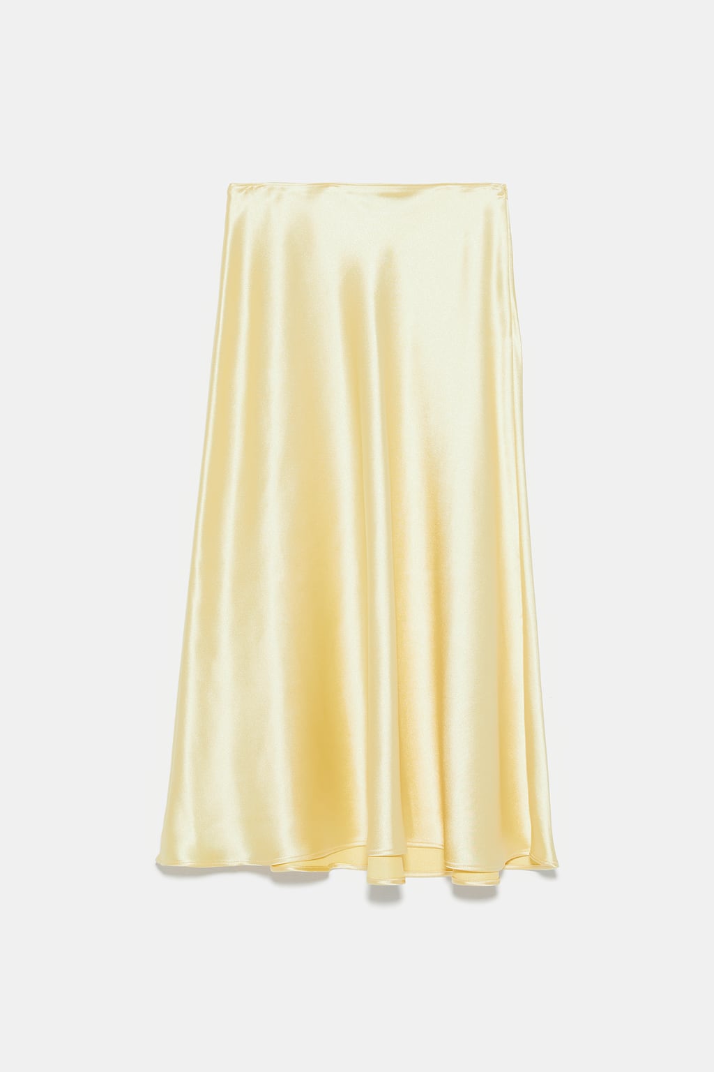 Falda midi satinada en color amarillo: 29,95 euros en Zara.