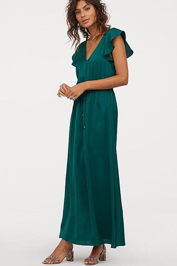 Vestido verde oscuro largo, con las mangas mariposa, de H&M.
