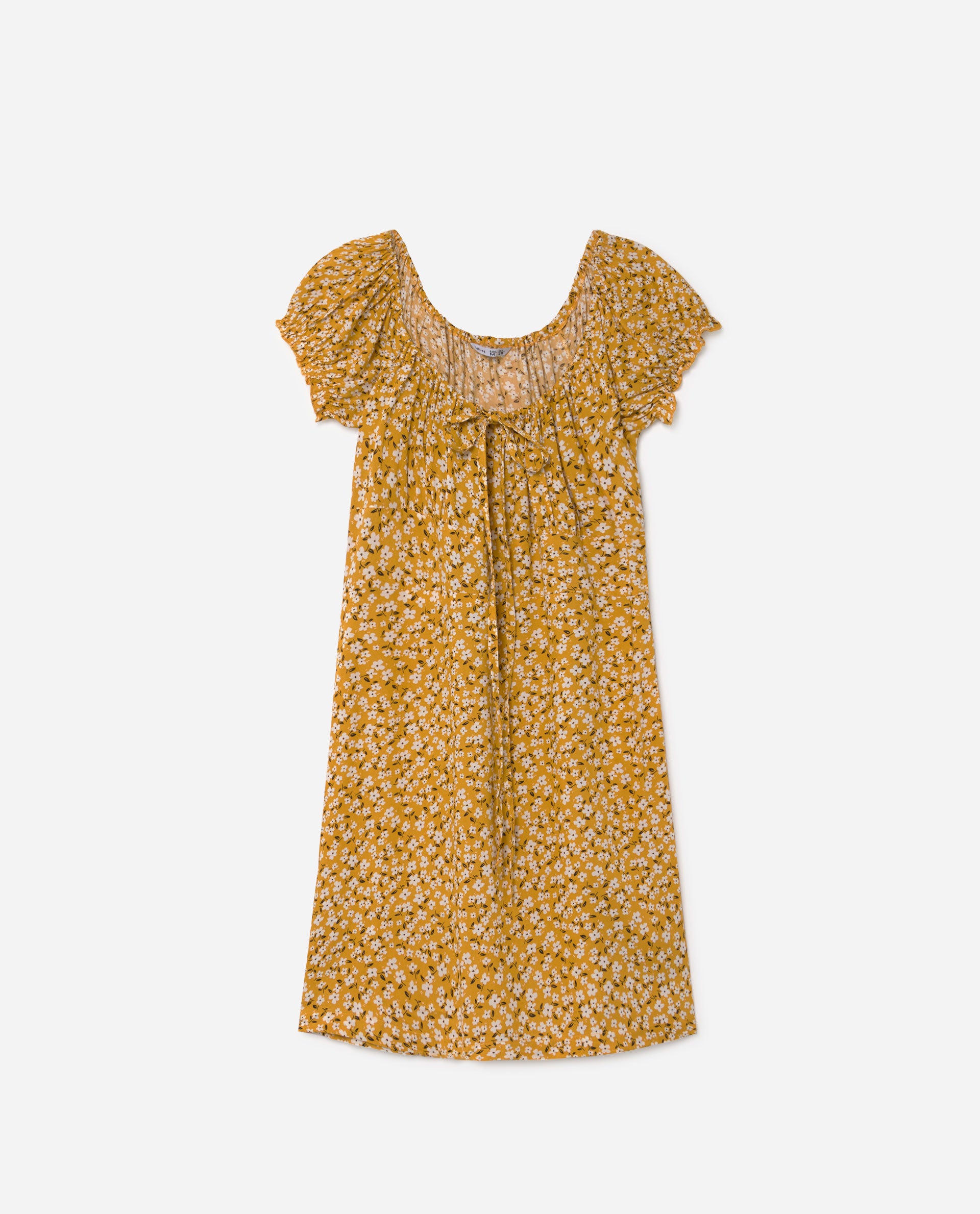 Vestido estilo mesonero con mangas abullonadas y estampado de flores blancas sobre tono mostaza. Disponible en más colores. (12,99 euros).