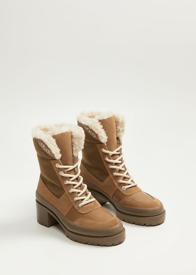Botas de piel con cordones con punta redonda e interior de borreguillo. El tacón mide 5 centímetros. Son de Mango y cuestan 69,99 euros.