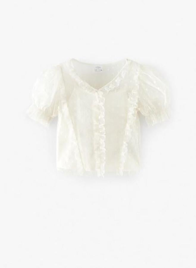 Camiseta de plumeti y volantes, rebajada de 10,95 a 6,99 euros.