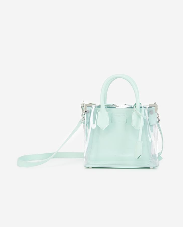 Bolso aguamarina con funda transparente, de The Kooples.