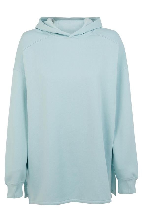 En color menta, esta sudadera oversize con capucha y aberturas en los laterales tiene un precio de 15 euros.