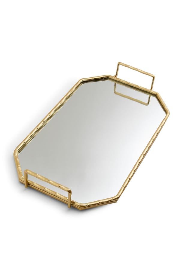 Con borde de efecto bambú en color dorado, esta bandeja de espejo tiene un precio de 7 euros.