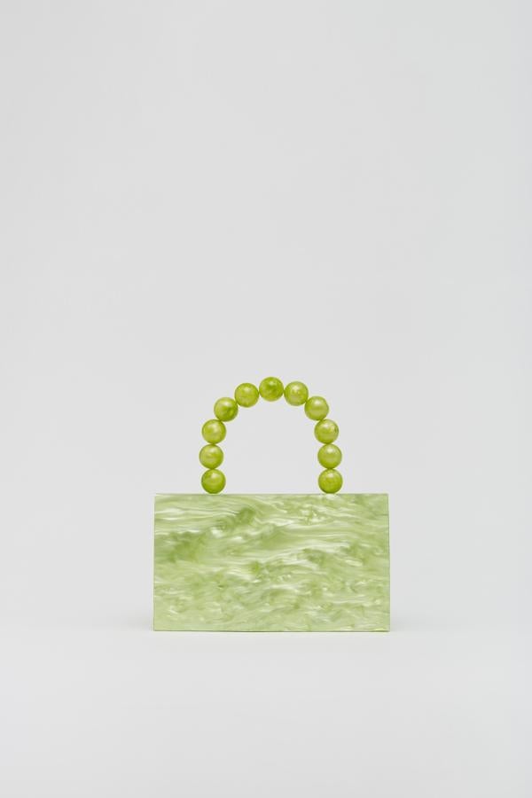 Caja de resina con asa corta, de Sfera (19,99 €).