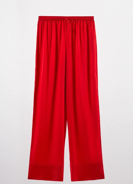 Imagen - En un vibrante color rojo y con tejido satinado, este pantalón fluido es muy cómodo.