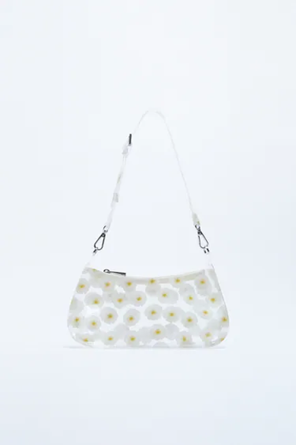 Bolso de vinilo transparente con estampado de flores.