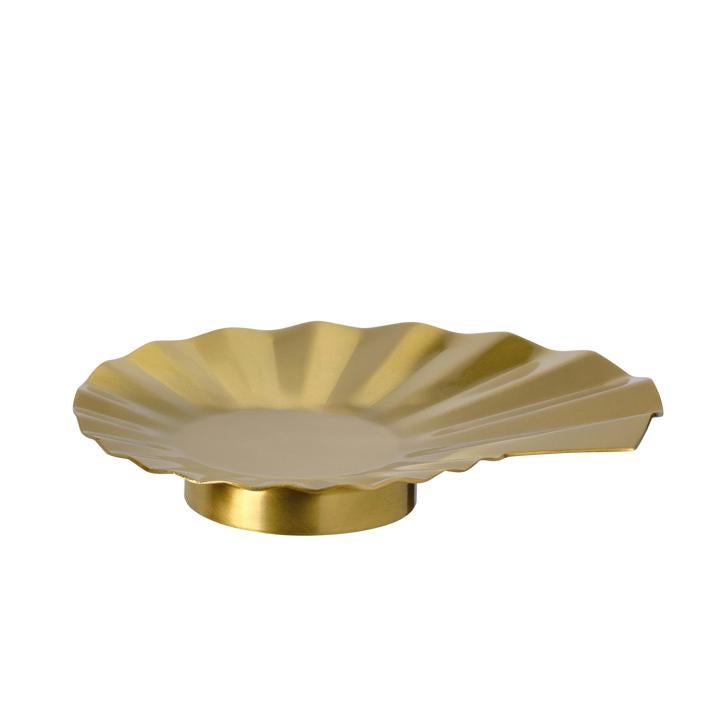 Soporte para vela en color dorado (3 euros).