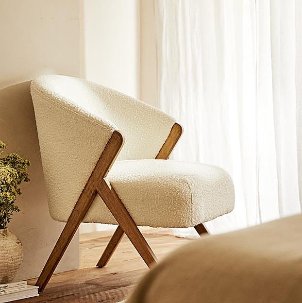 Silla tapizada en bouclé de Zara Home (249 euros).