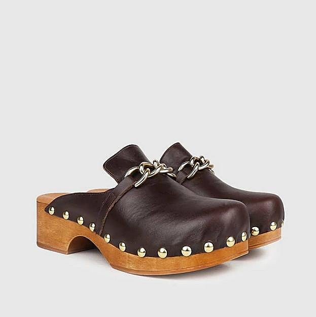 Imagen principal - Apúntate a la tendencia de los zuecos, el calzado cómodo que triunfa en el street style y es perfecto para la primavera