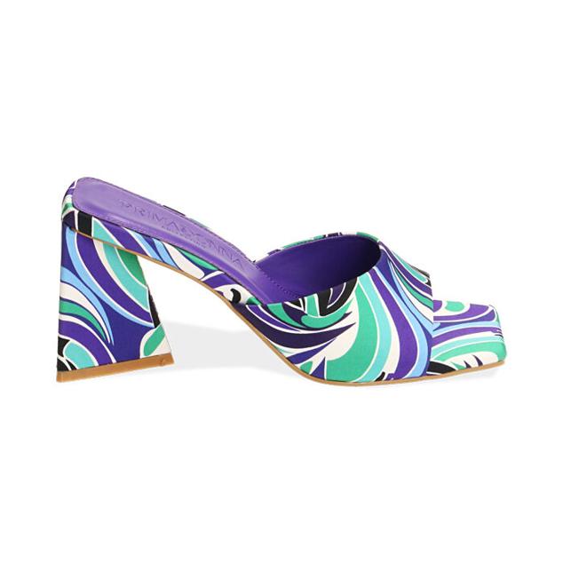 Los mules con estampado multicolor psicodélico en satén de Prima Donna son ideales para mujeres que buscan looks rompedores. Precio: 49,99 €.