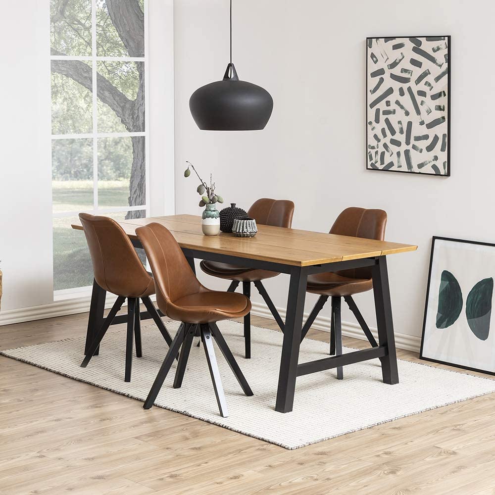 De estética retro e inspiradas en la famosa silla DSW que Charles y Ray Eames crearon para el MoMa de Nueva York en 1950, esta versión low cost en cuero y acero las puedes  comprar en Amazon  por menos de 120 euros (el conjunto de dos).