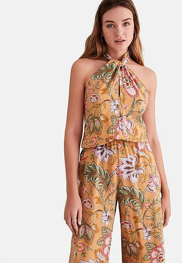 Mono con estampado floral y fondo amarillo para alegrar la rutina estival. Es de Women’s Secret. Precio: 49,99 €.