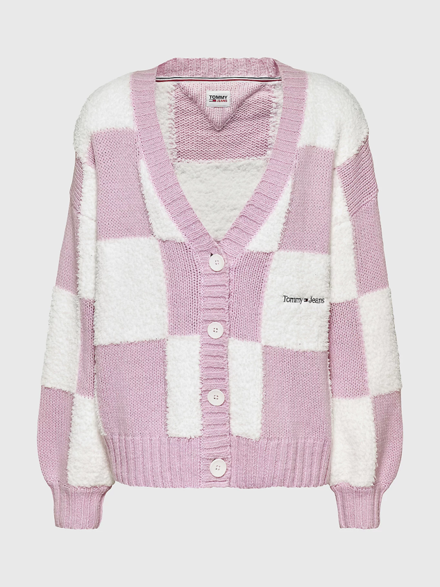 Cárdigan oversize con diseño de cuadro damero en tonos pastel para looks más románticos y llamativos. Es de Tommy Jeans. Precio: 129,90 €.