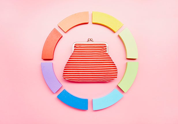 Pie chart made of colorful building blocks and wallet on pink background