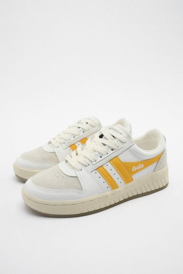 La colección Gola x Zara tiene como resultado estas zapatillas de estilo retro con una combinación de colores y materiales en el corte y una suela con algo de volumen. Precio: 89,95 euros.