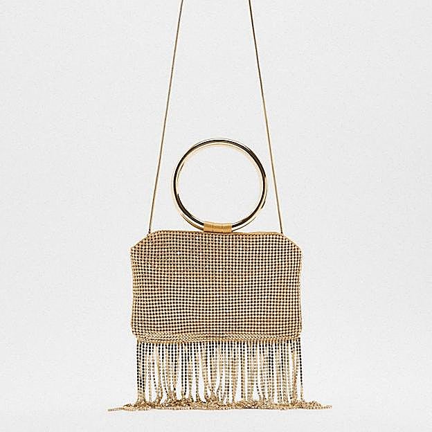 Bolso de mano con flecos dorado