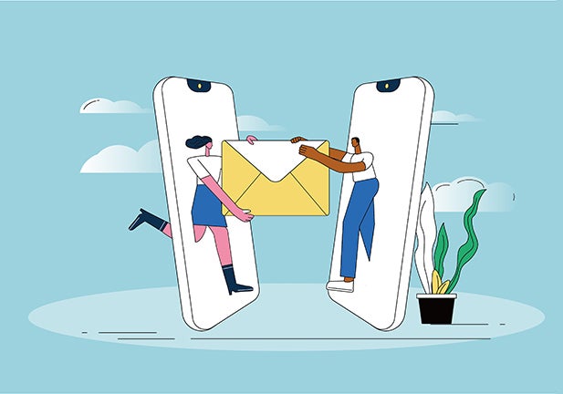 Two people use mobile phones to send mail.