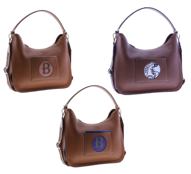 Este bolddo de Box San Sebastián de estilo góndola tiene un asa corta de hombro diseñada para ocultarse con un simple movimiento de presión convirtiendo el bolso en una bandolera gracias a su correa más larga. Tiene un bolsillo sobrepuesto y plano con un vaciado esférico en la parte central que permite dar creatividad y vida a su interior introduciendo láminas, postales, dibujos, cueros, etc.