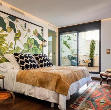 Imagen secundaria 1 - Pájaro Rebelde, un hotel boutique en el barrio sevillano de San Lorenzo.
