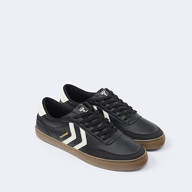 Zapatillas en efecto piel negras con rayas blancas a contraste