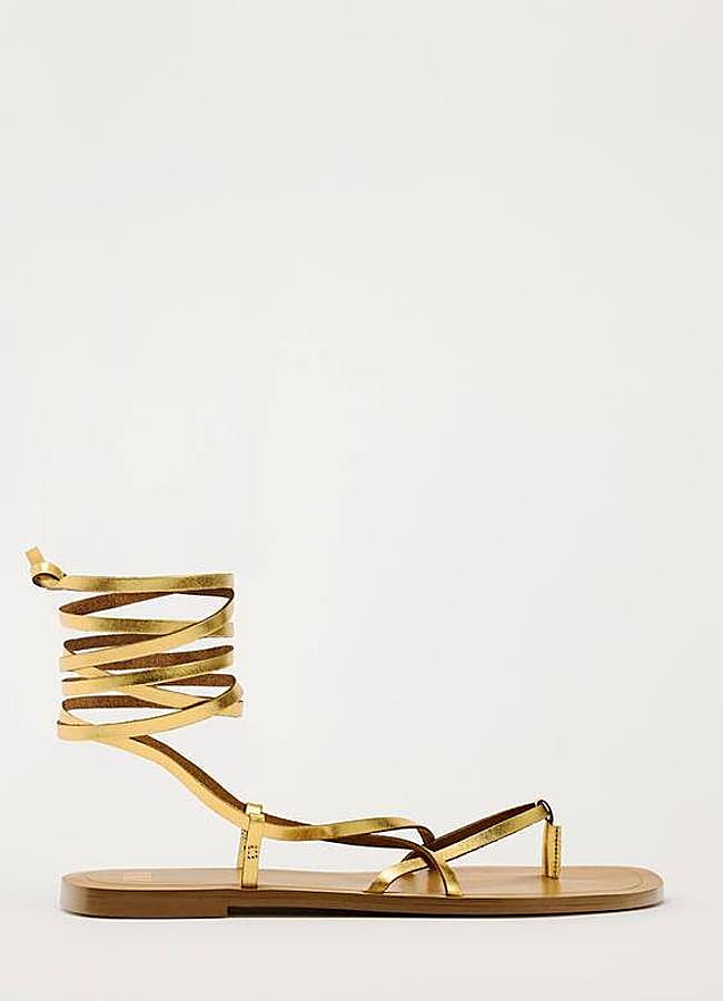 Imagen - Sandalias doradas planas atadas