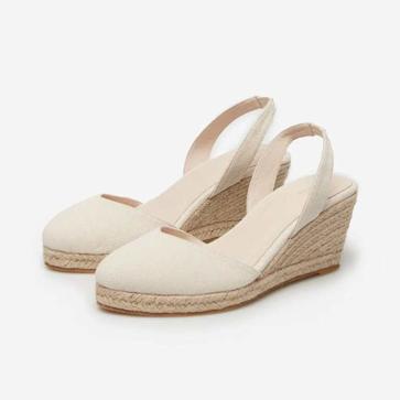 Imagen secundaria 1 - Bolso tote papel trenzado (15,99€)/ Cuña yute canvas (39,99€)/ Vestido con bolsillos (49,99 €)