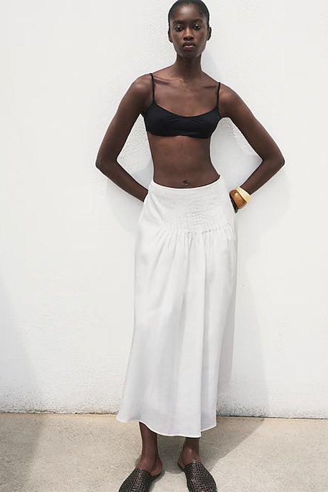 Falda blanca pinzas.