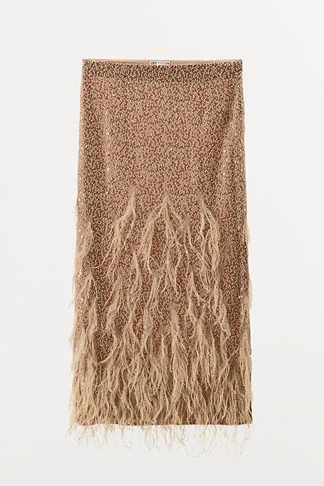 Falda lentejuelas plumas (199€)