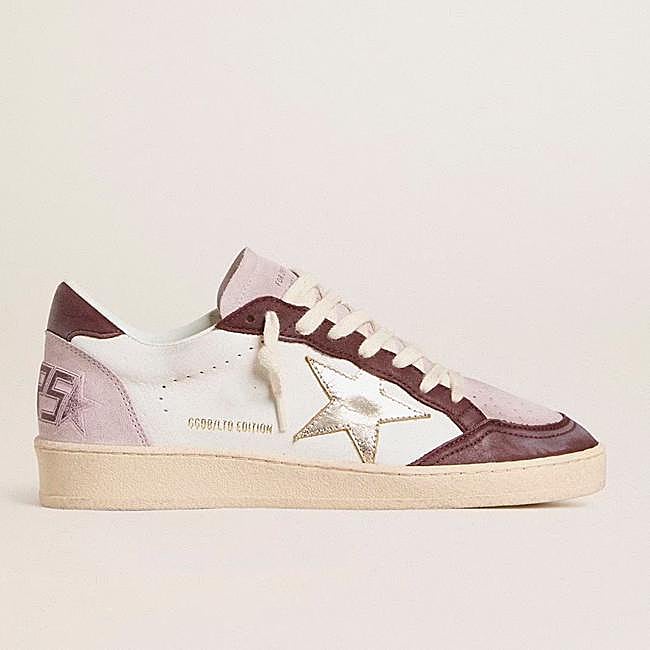 Zapatilla en tonos rosados y burdeos de Golden Goose.