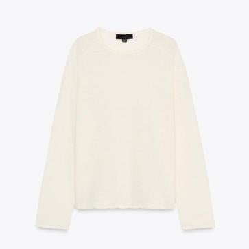 Imagen secundaria 1 - Bolso solapa brillante de Desigual (69,95€)/ Jersey punto con lino de Zara (25,95€)/ Pantalón amplio de H&M (29,99€)