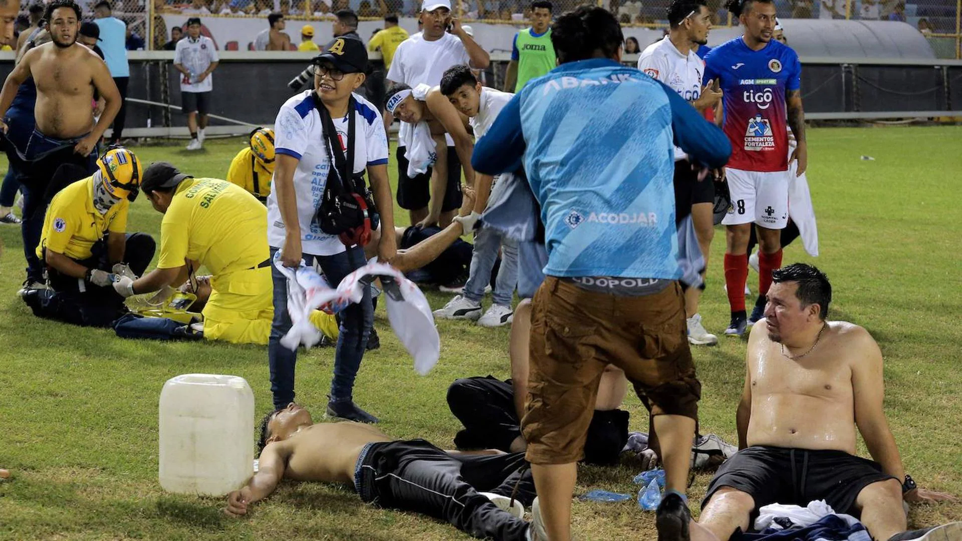 Twelve dead and hundreds injured in a stampede at a soccer stadium in El Salvador