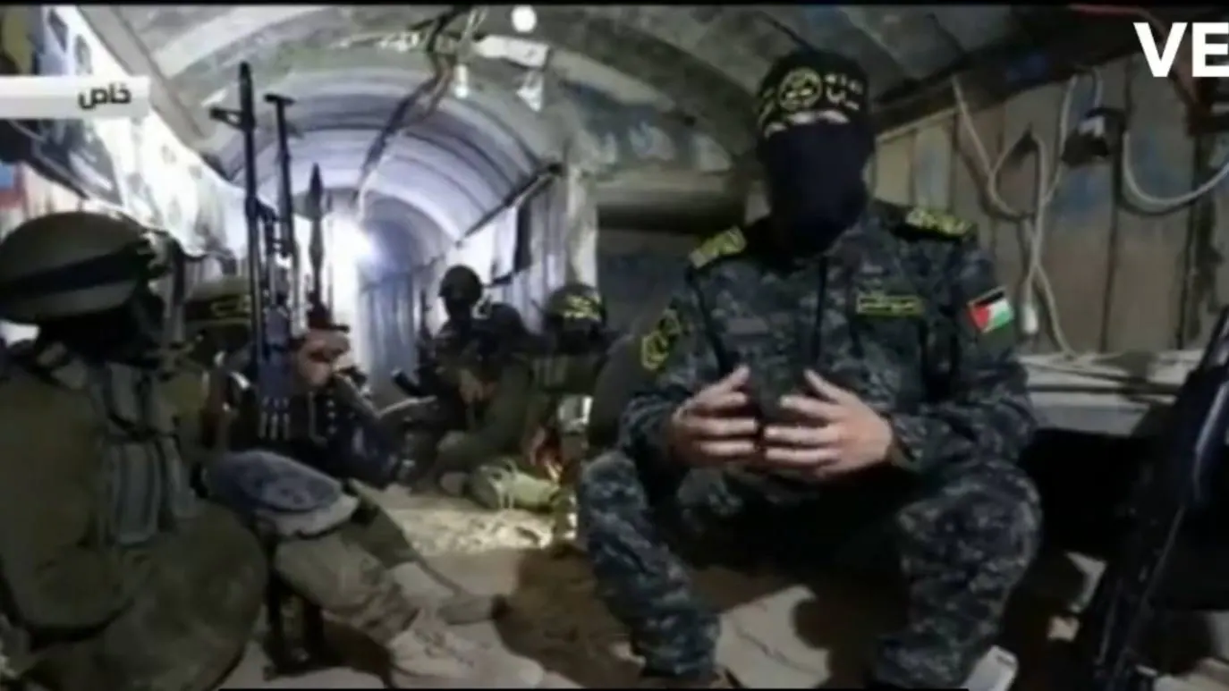Secondary image 1 - Above, a Russia Today journalist in the Islamic Jihad tunnels.  Below, the interior of the underground network, with terrorists inside.