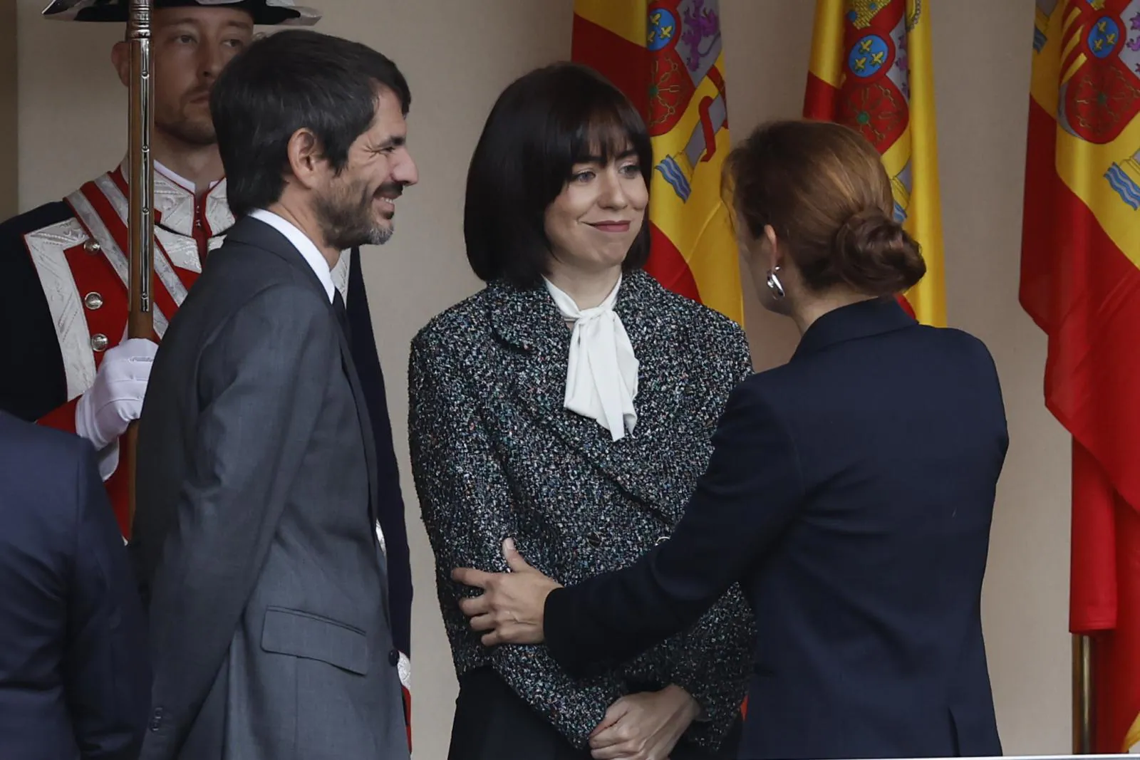 Los ministros Ernest Urtasun, Diana Morant y Mónica García conversan a su llegada este sábado para asistir al desfile por el Día de la Fiesta Nacional.