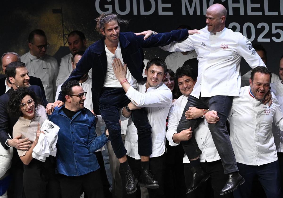 French chefs Hugo Roellinger (C-L) and Christopher Coutanceau after winning three Michelin stars