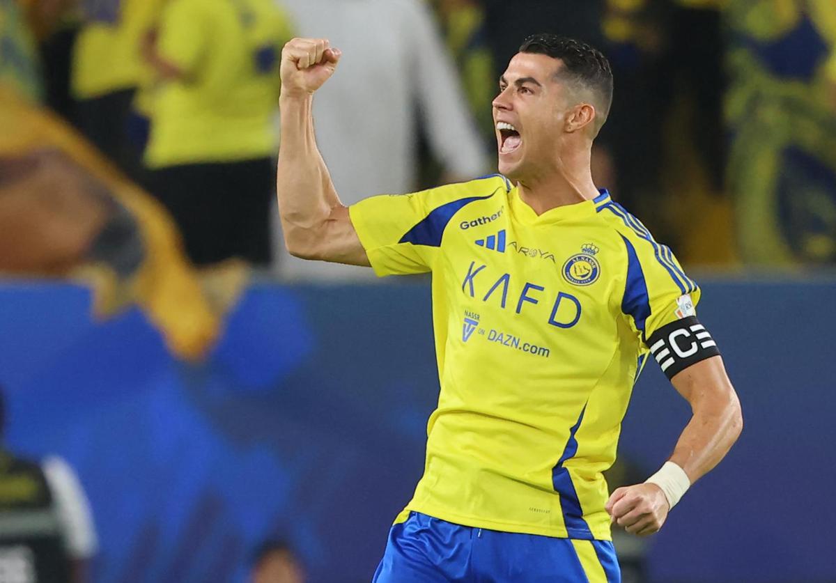 Cristiano Ronaldo celebrates a goal wearing the Al Nassr jersey.