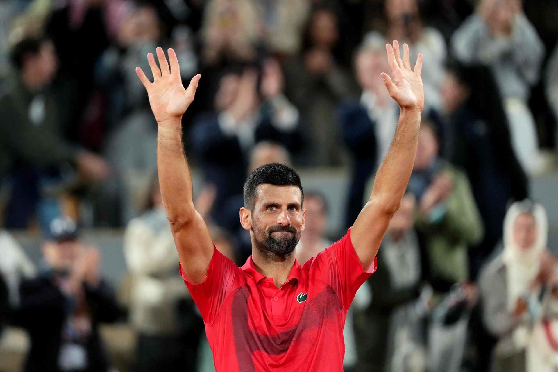 Djokovic thanks the Roland Garros crowd for their applause after what might have been his last active match in the tournament.