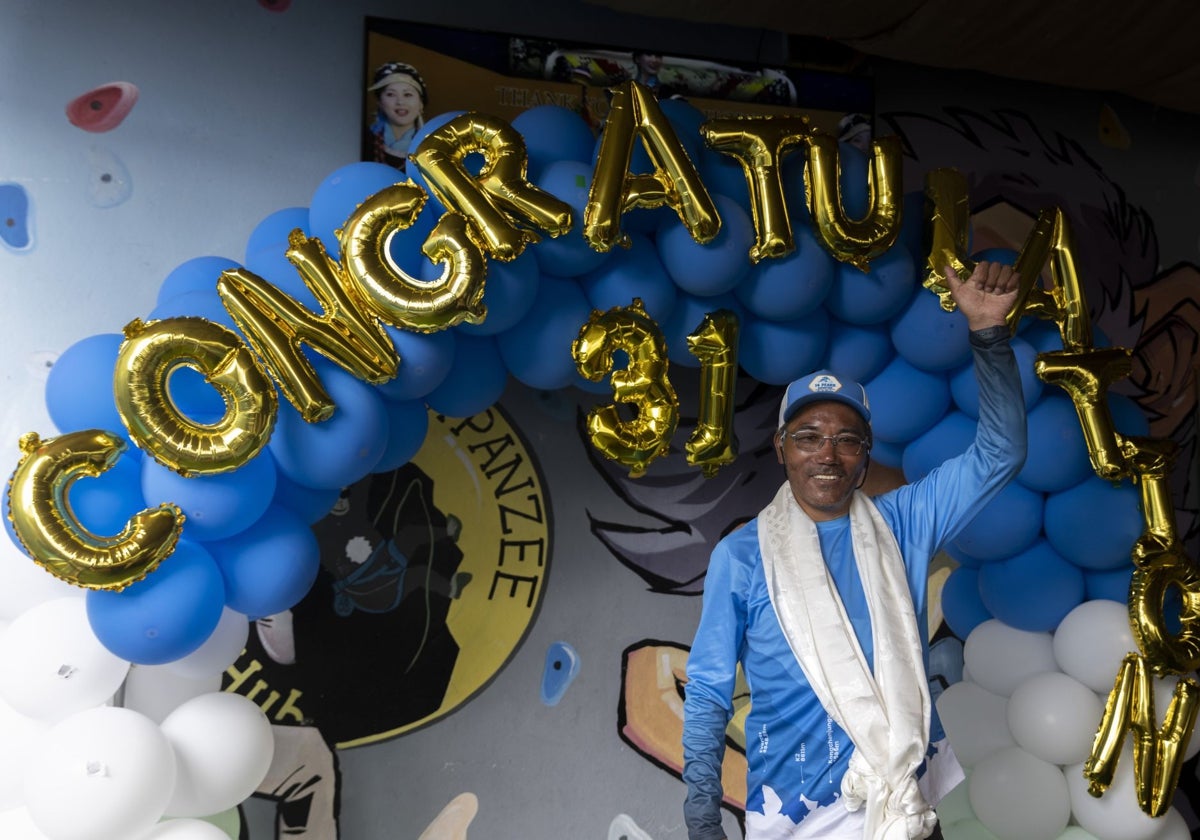 Mountaineer Kami Rita celebrates his 31st ascent of Everest, setting a new world record, in Kathmandu, Nepal.