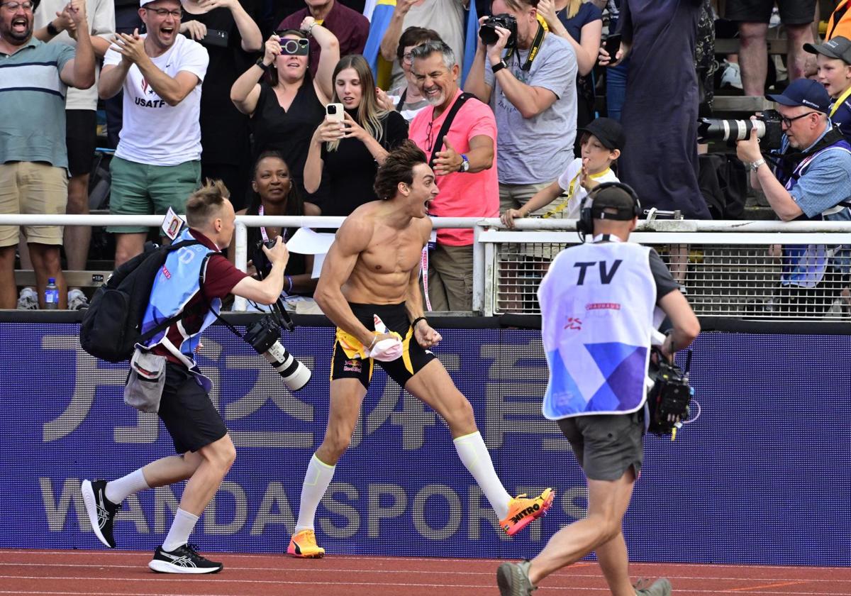 Armand Duplantis celebrates his new world record jump.