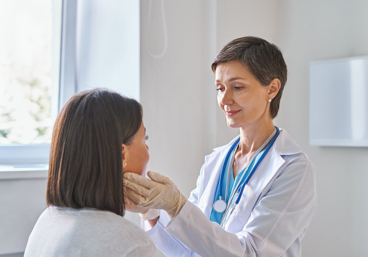 A family doctor reviews a patient's health status.