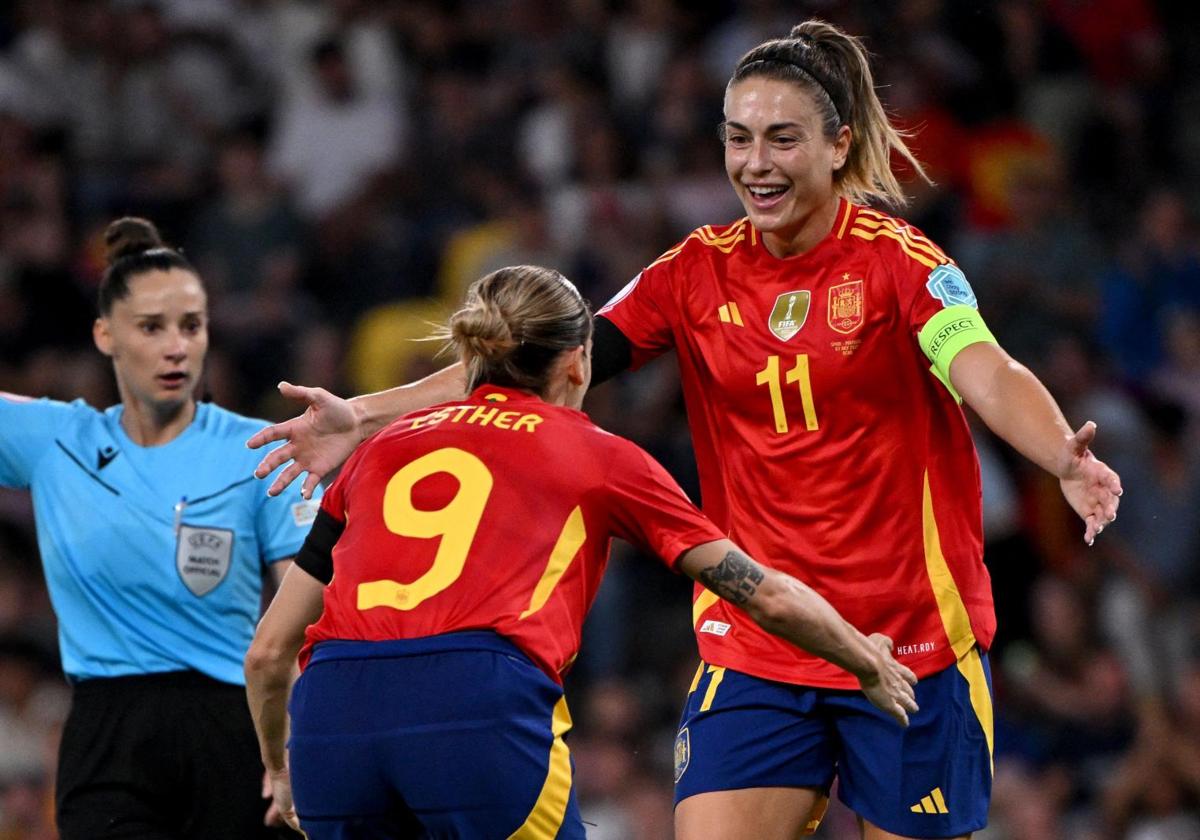 Esther celebrates with Alexia after scoring Spain's third goal against Portugal.