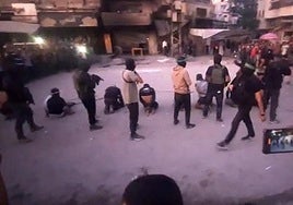 Imagen de la ejecución sumaria de ocho palestinos rivales a Hamás en Sabra justo después de la tregua.