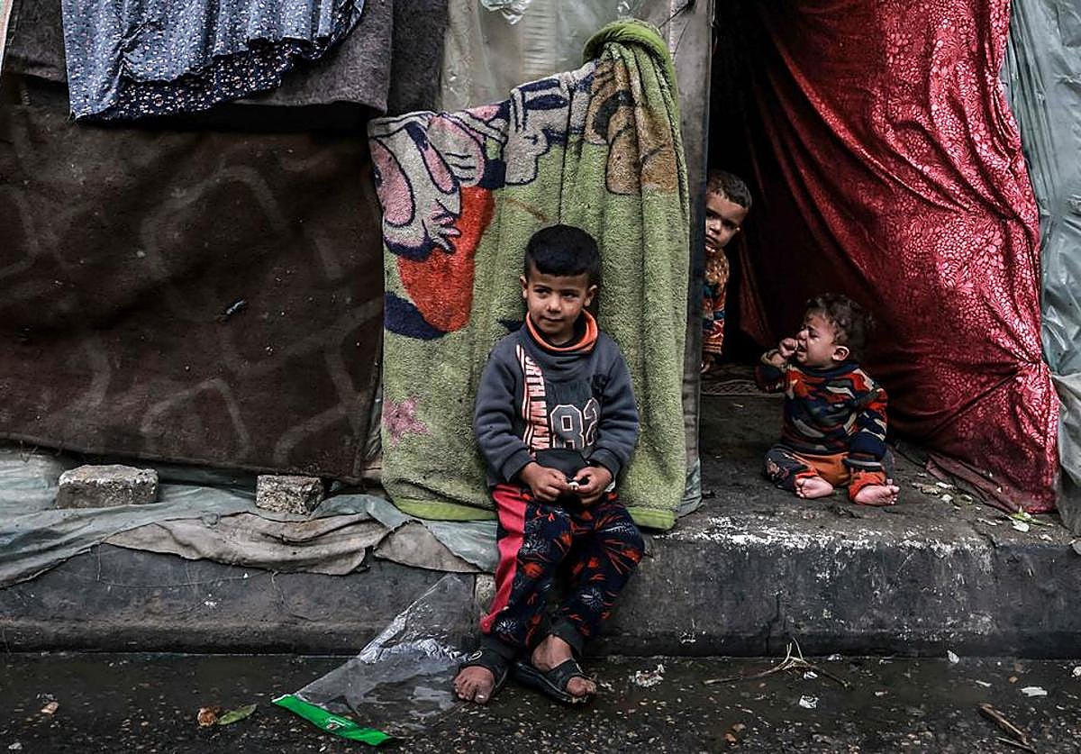Three children in a refugee camp in the Gaza Strip.