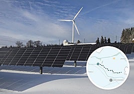 Planta solar y molino eólico en un parque híbrido.