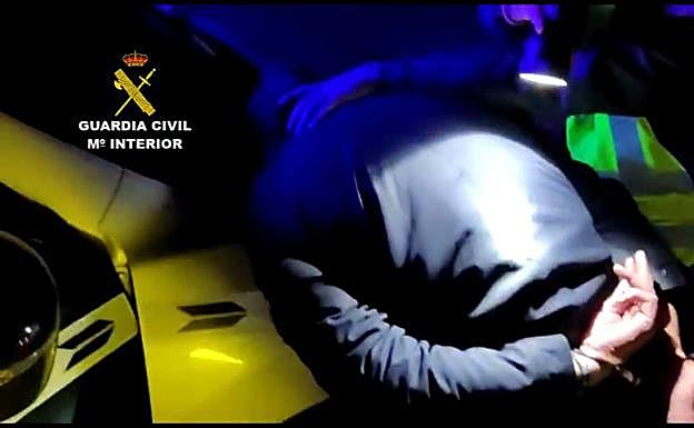 Police officers detain the individual after the high-speed chase.