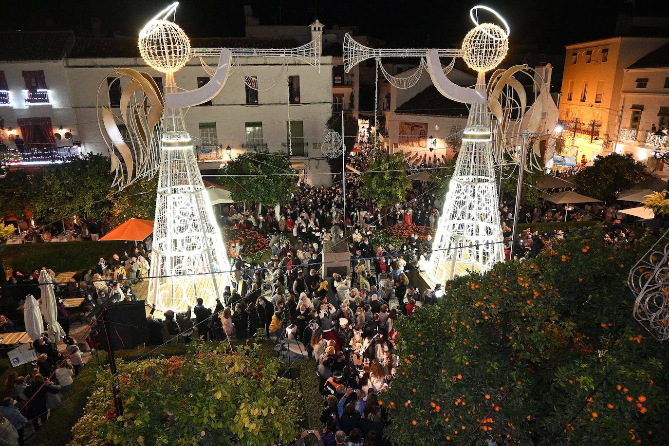 Crowds gathered at Marbella's Christmas lights despite the threat of rain.