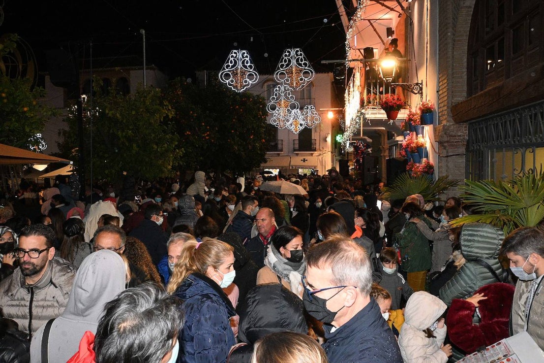 Crowds gathered at Marbella's Christmas lights despite the threat of rain.